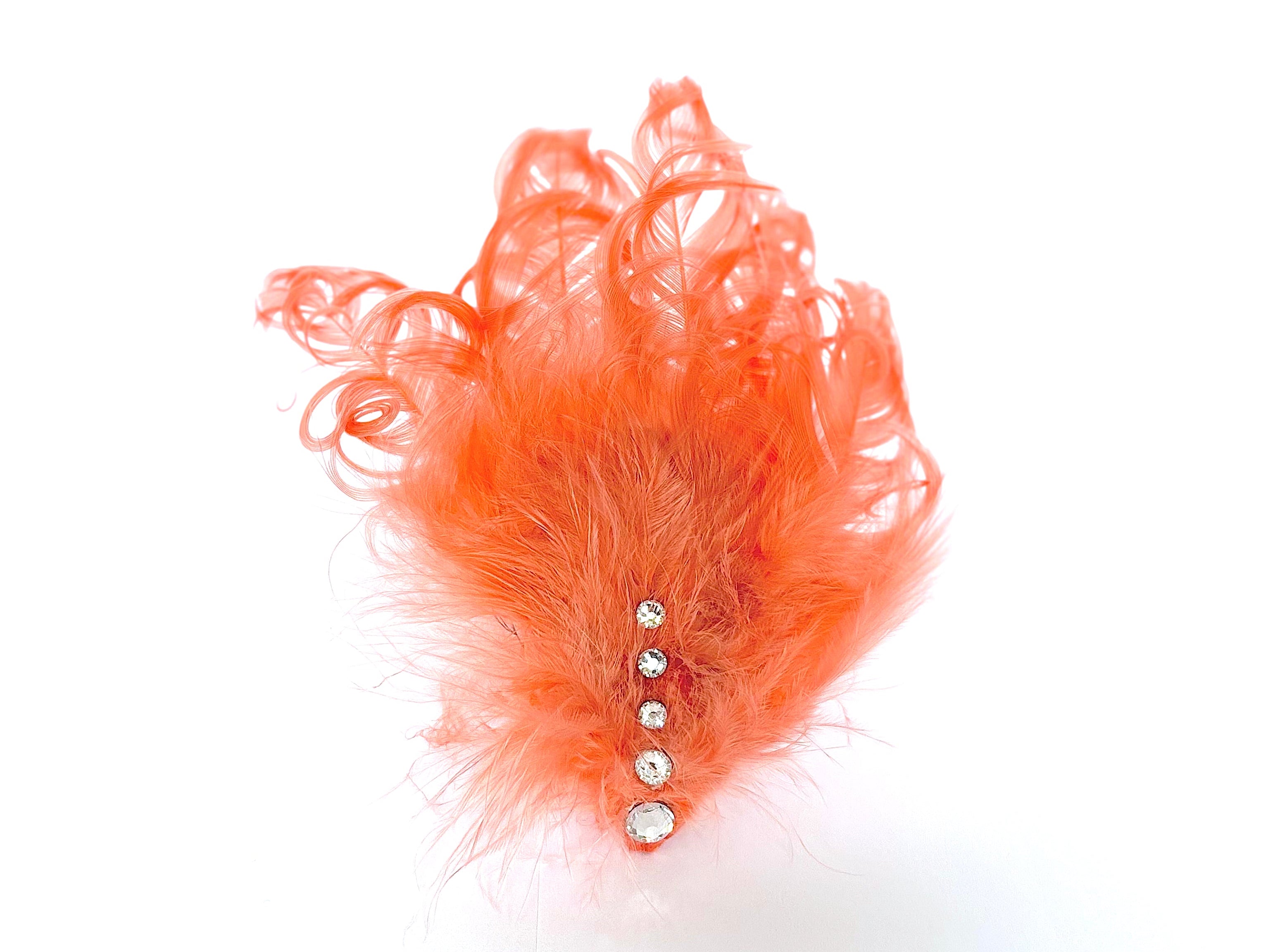 Handmade coral feather hair clip with crystal accent, designer hair accessory by Nicole Ho London.