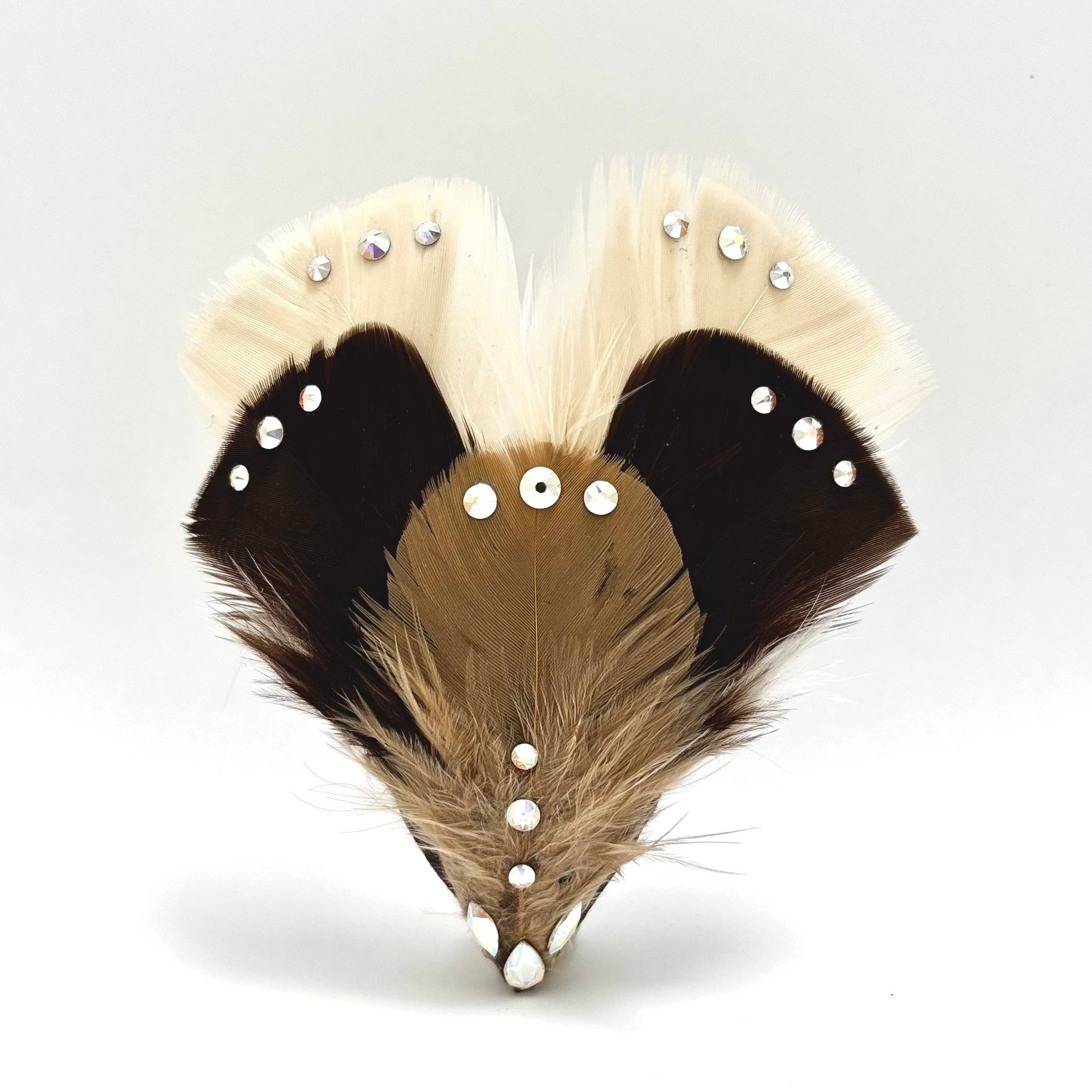Handmade feather hair clip with ivory, brown and beige fan-shaped feather arrangement and subtle curved crystal detailing for elegant styling by Nicole Ho.