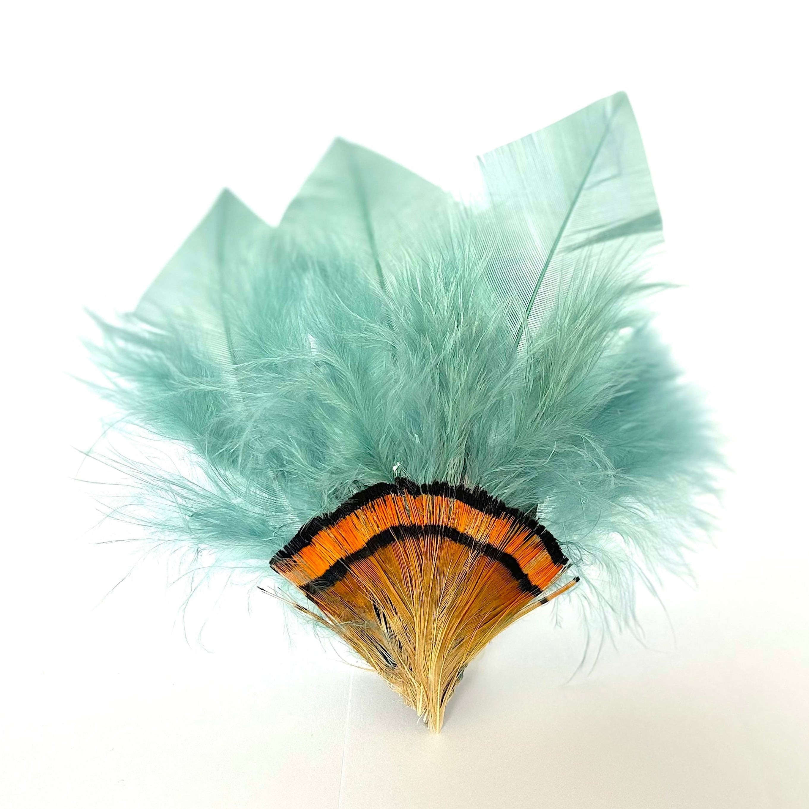 Handmade turquoise feather hair clip with golden pheasant detail by Nicole Ho London.